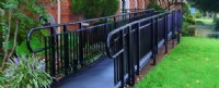 Commercial aluminum ramp installed in New England with black powder-coated finish