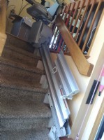 manual folding rail for stairlift flipped up to remove tripping hazard